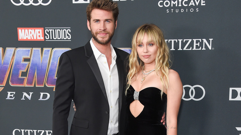 Liam Hemsworth Miley Cyrus posing