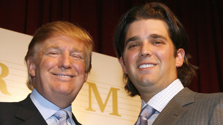 Donald Trump Sr. and Jr. smiling