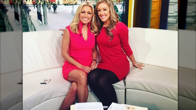 Ainsley Earhardt in a pink dress on set