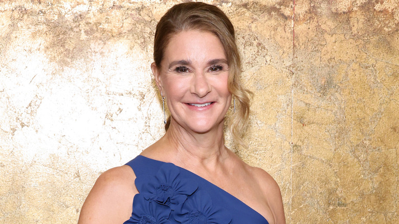 Melinda Gates smiling in a blue gown