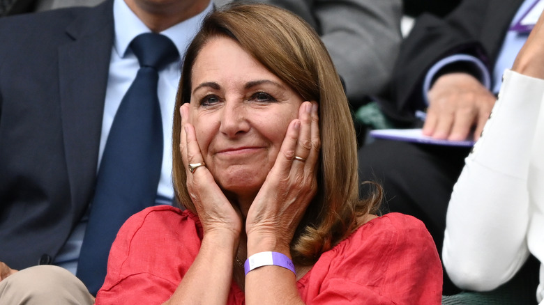 Carole Middleton holding face hands