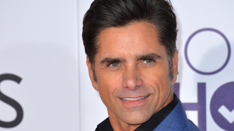John Stamos in blue jacket