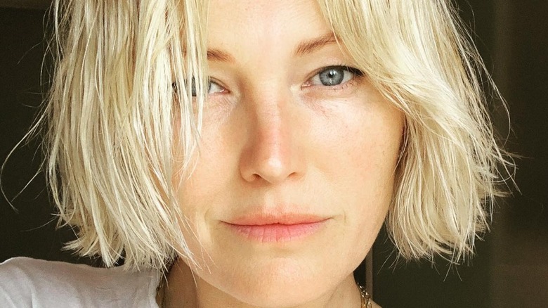 Sporting a makeup-free look, Malin Akerman stares into the camera.
