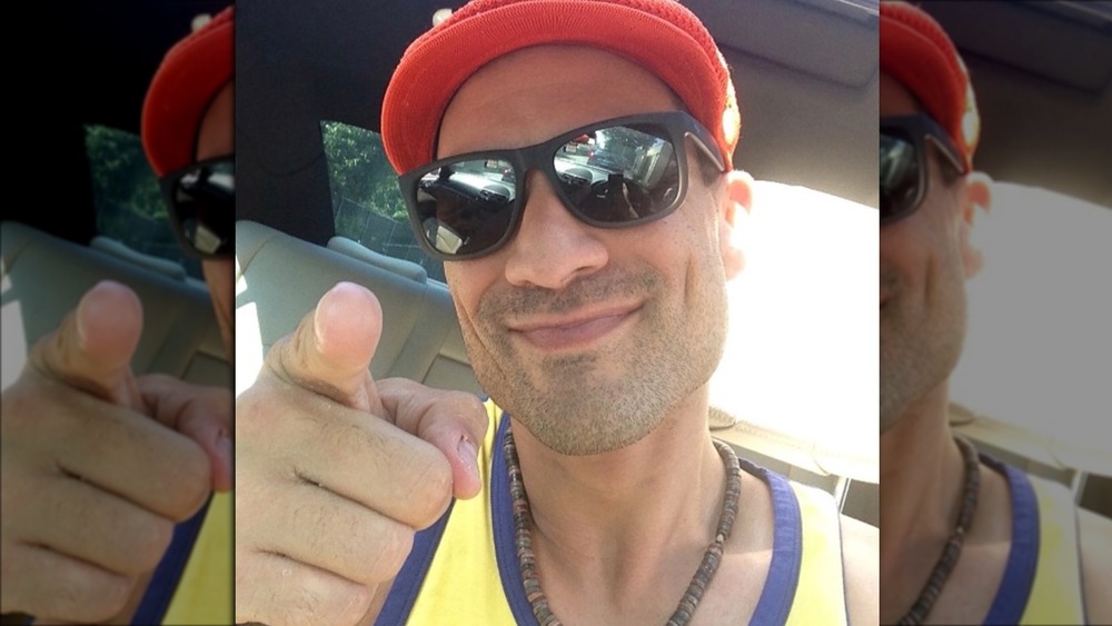 Charlie Balducci pointing in a selfie wearing sunglasses