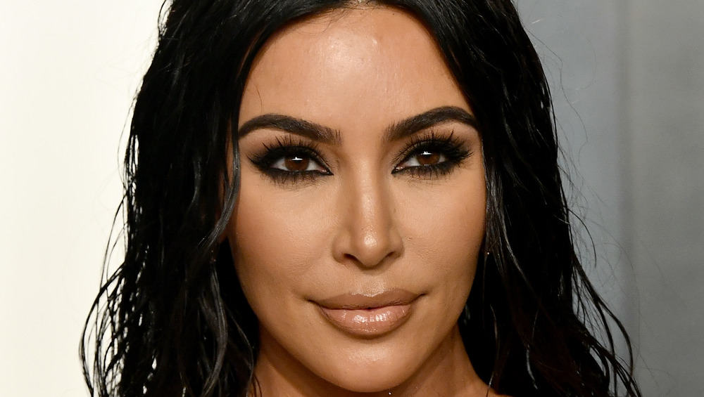 Kim Kardashian smirking
