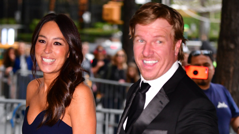Chip and Joanna Gaines arriving to a red carpet.