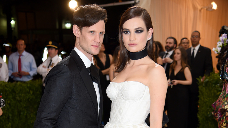 Matt Smith in a black tuxedo and bowtie with Lil James in a white strapless gown and black neck tie