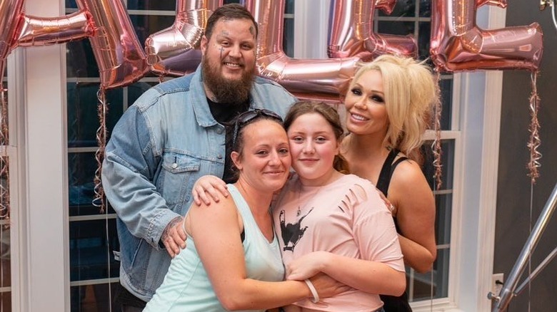 Bailee Ann with her mom, stepmom, and dad in 2020