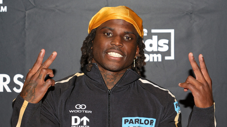 Tyreek Hill poses in 2023