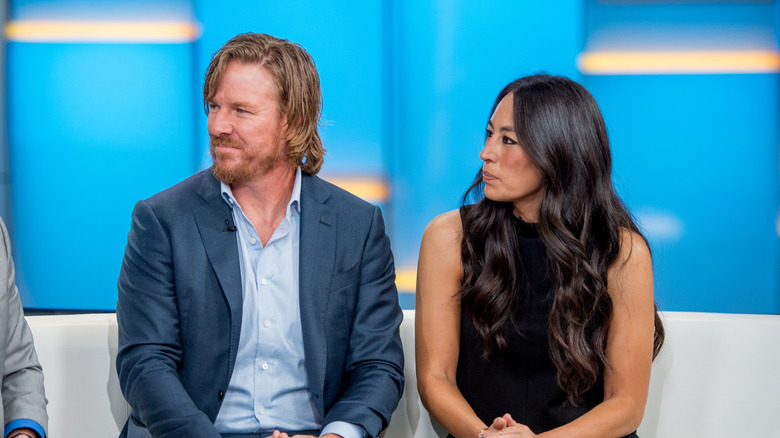 Chip and Joanna Gaines looking sideways