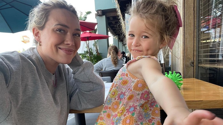 Hilary Duff posing with her daughter Banks
