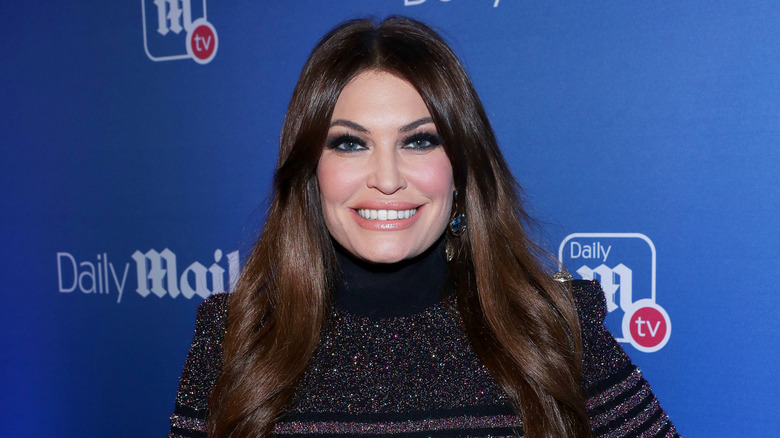 Kimberly Guilfoyle posing for photos while attending the DailyMail.com and DailyMailTV 2019 holiday party