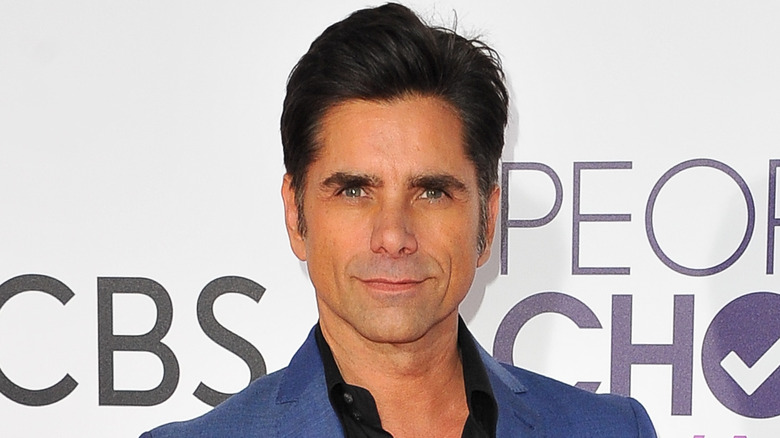 John Stamos in a purple suit