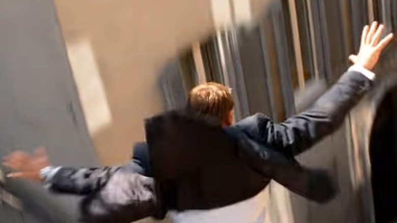 Daniel Craig James Bond jumping on a moving bus in Quantum of Solace