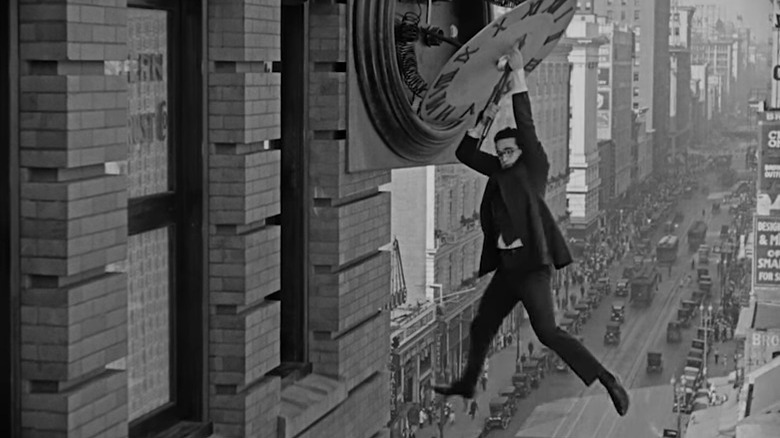 Harold Lloyd hanging from a clock tower in Safety Last!