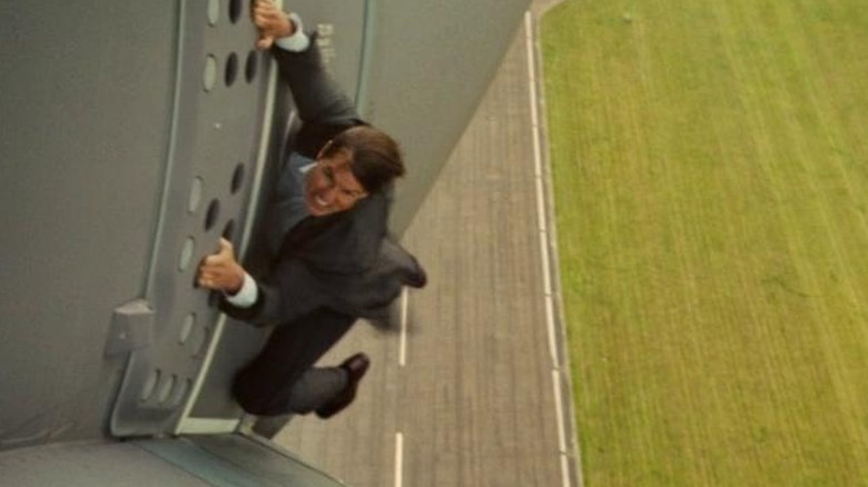 Tom Cruise hanging off a plane in Mission Impossible Rogue Nation