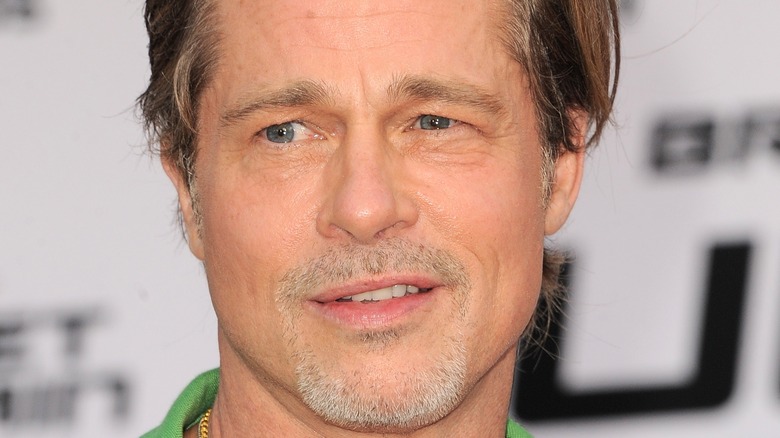 Brad Pitt looking serious on red carpet