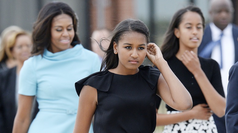 Sasha with Michelle and Malia Obama, all walking