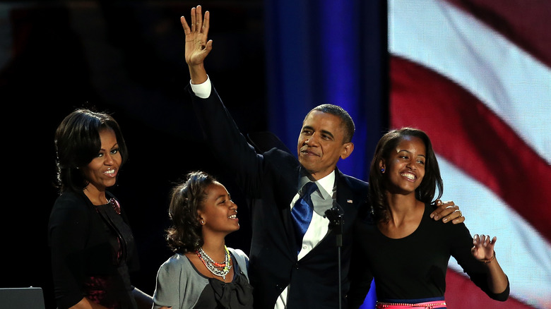 Barack Obama and his family posing for photos