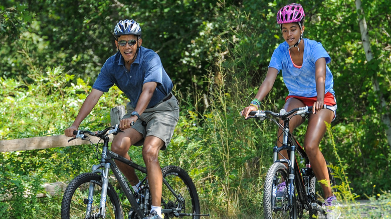 Barack Obama bike riding with his family