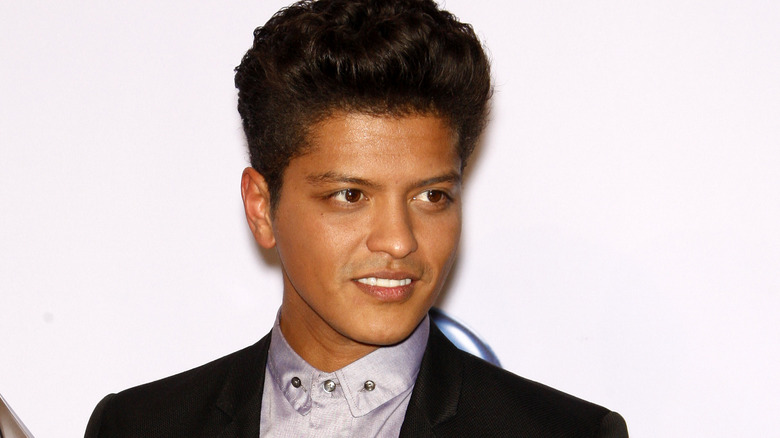 Bruno Mars smiling slightly