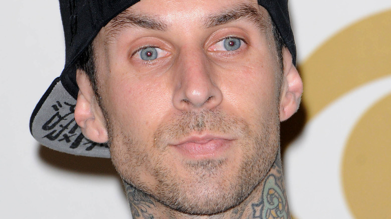 Travis Barker looking away