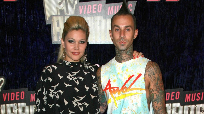 Travis Barker and Shanna Moakler posing
