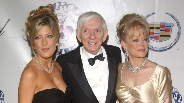 Tori Spelling posing with parents Aaron and Candy Spelling pose 