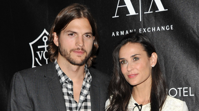 Demi Moore and Ashton Kutcher pose for a photo in 2011