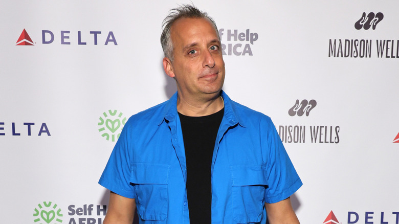 Joe Gatto wearing a blue shirt atop a black t-shirt