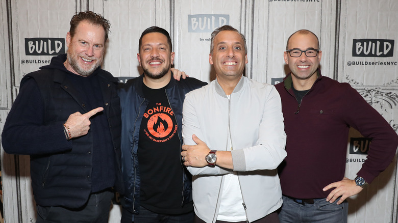 Joe Gatto posing with the rest of the Impractical Jokers cast