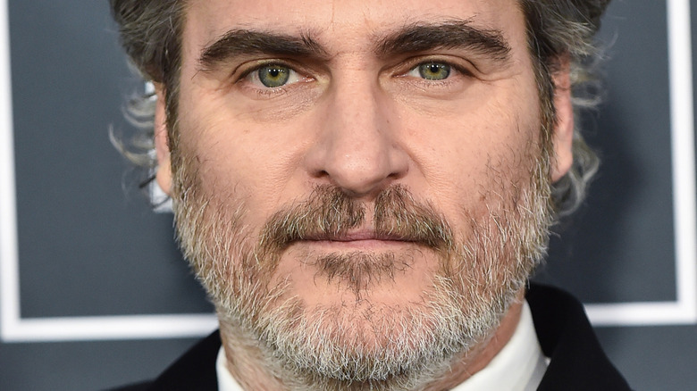 Joaquin Phoenix smiling white beard