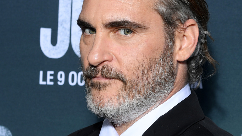 Joaquin Phoenix side glancing beard