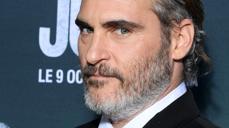 Joaquin Phoenix side glancing beard