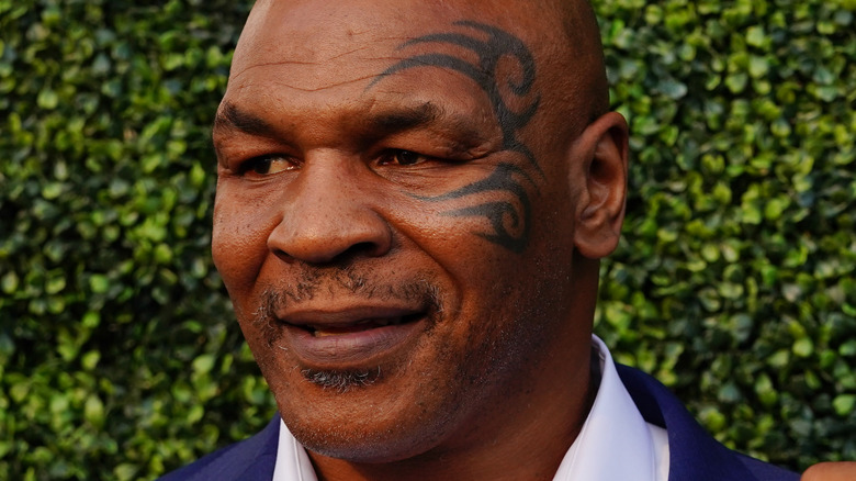 Mike Tyson in front of greenery