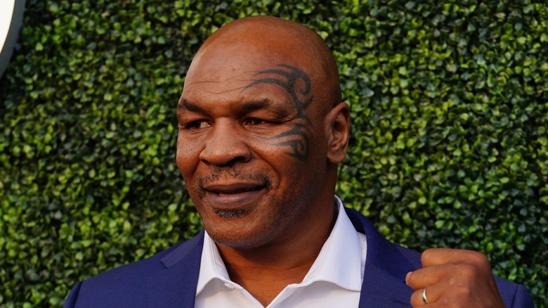 Mike Tyson in front of greenery