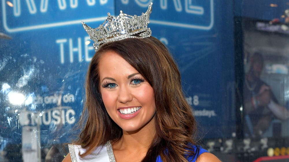 Cara Mund smiling in her Miss America crown and sash