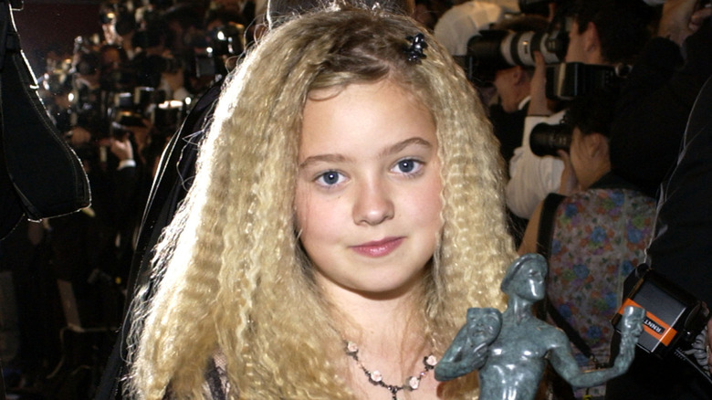 Young Madylin Sweeten holds statuette at SAG Awards