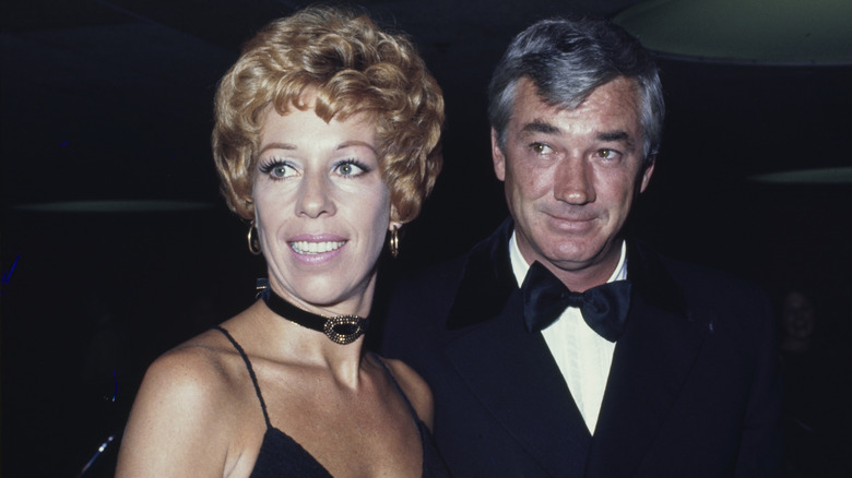 Carol Burnett wears a black and gold choker beside Joe Hamilton, who wears a tux.