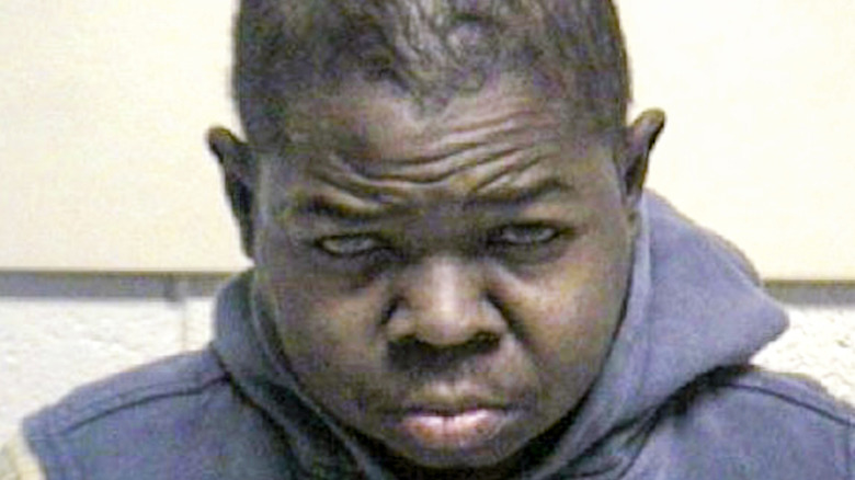 Gary Coleman posing for mug shot