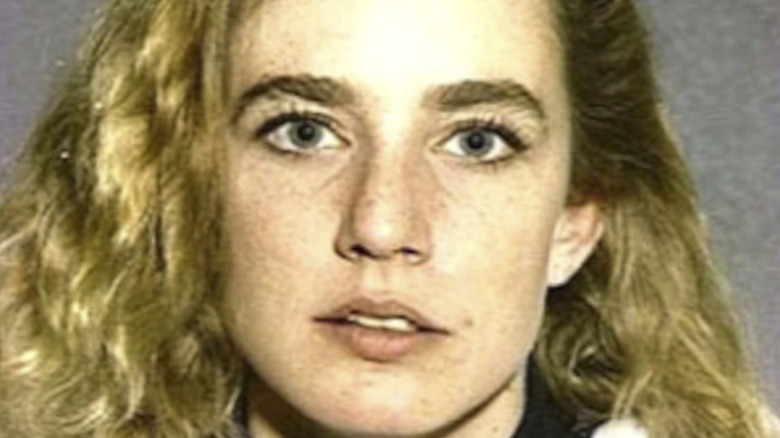 Dana Plato posing for mug shot