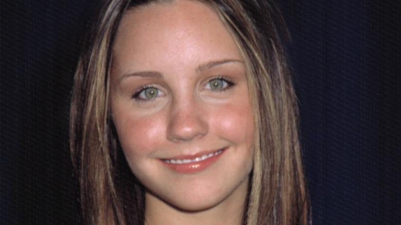 Amanda Bynes pictured here smiling in 2002 at 16 years old.