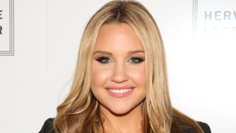 Amanda Bynes smiling in 2010 at 24 years old.