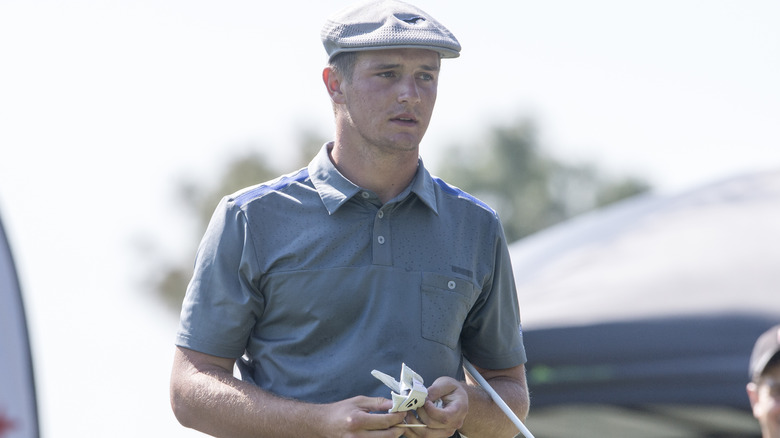 Bryson DeChambeau wears checked cap