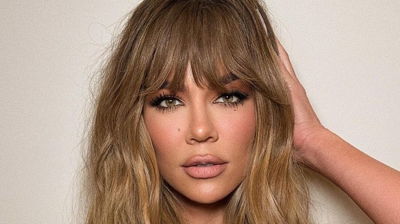 Khloe Kardashian posing for a photo 