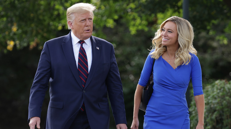 Kayleigh McEnany smiling at Donald Trump
