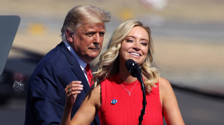 Donald Trump and Kayleigh McEnany at a podium