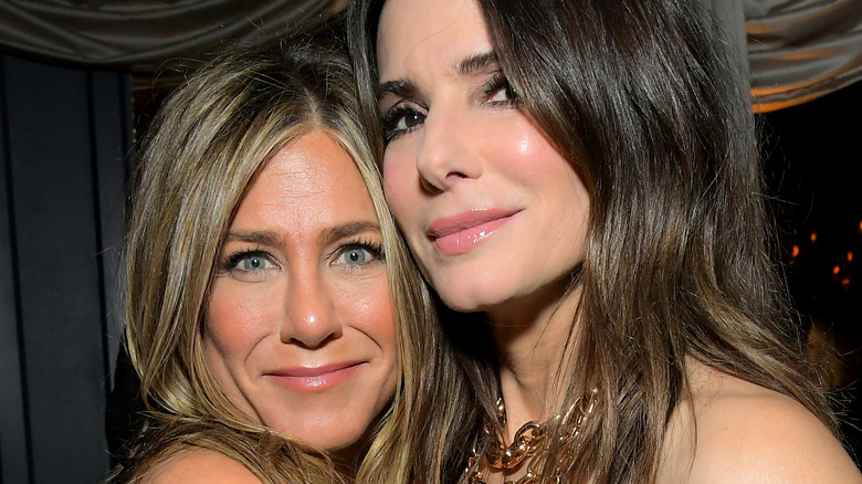 Jennifer Aniston and Sandra Bullock pose