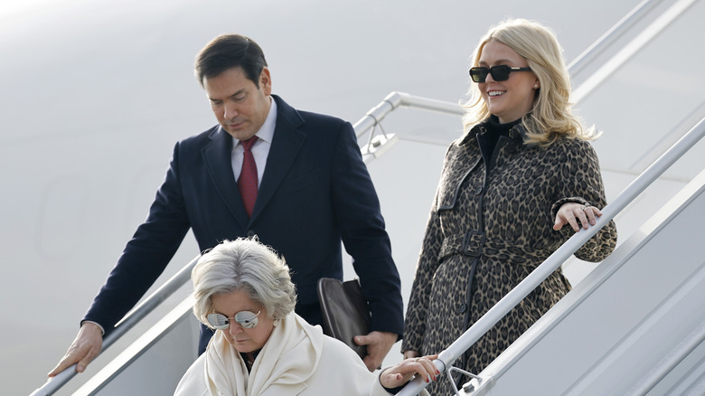 Karoline Leavitt pictured with Marco Rubio and Susie Wiles