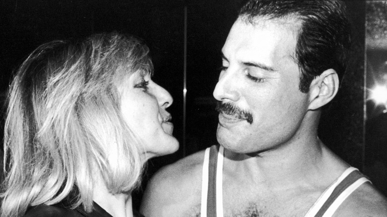 Mary Austin and Freddie Mercury looking at each other